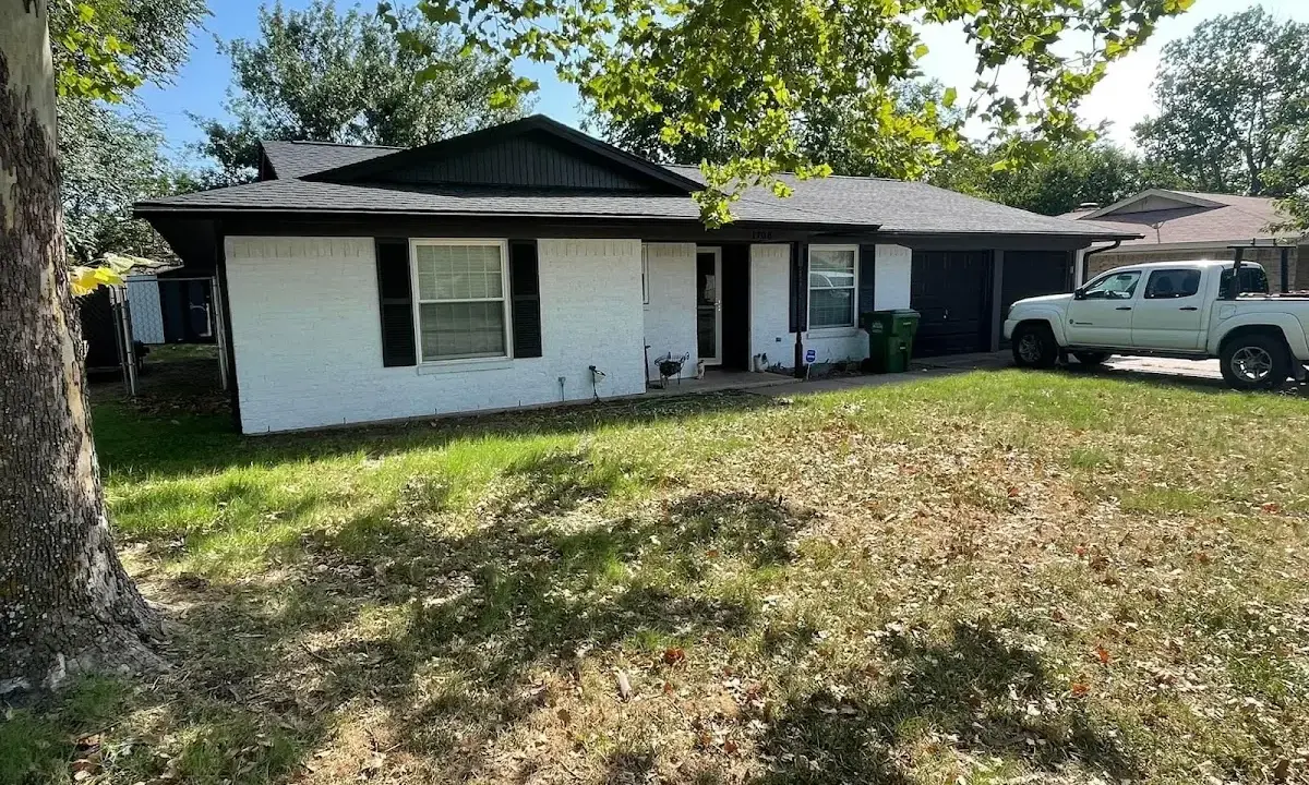 Professional roofing crew working on a residential roof in Valley City